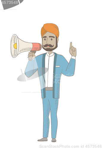 Image of Hindu businessman talking into loudspeaker.