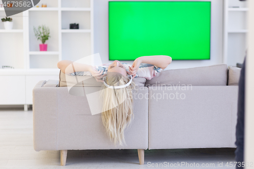 Image of girl enjoying music through headphones