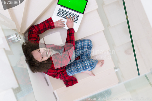 Image of freelancer in bathrobe working from home