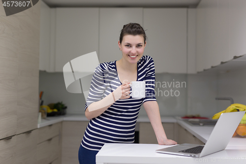 Image of woman drinking coffee enjoying relaxing lifestyle