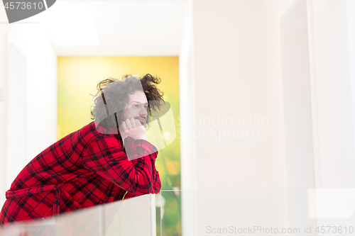 Image of portrait of young man in bathrobe