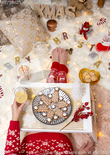 Image of Christmas food among Christmas decorations in cosy home