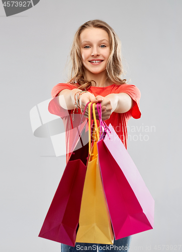 Image of smiling teenage girl with shopping bags