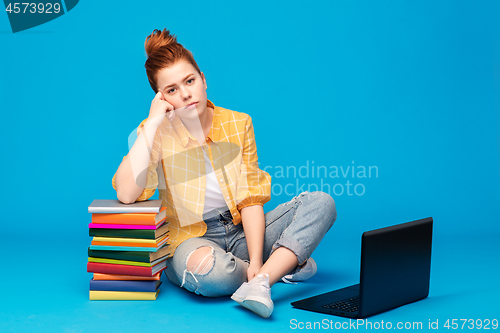 Image of sad red haired teenage student girl with laptop