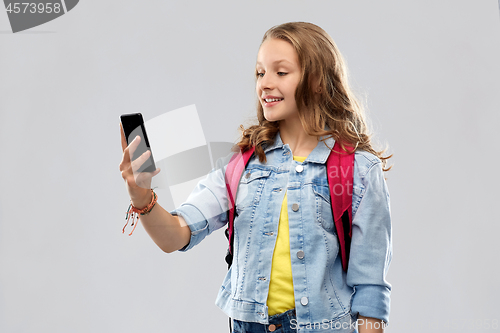 Image of teenage student girl taking selfie by smartphone