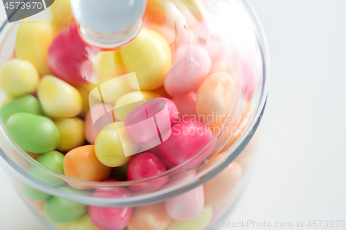 Image of close up of glass jar with colorful candy drops