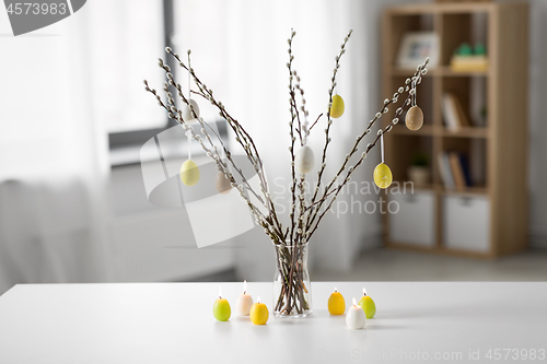 Image of pussy willow branches decorated by easter eggs