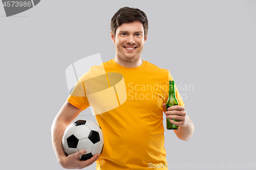 Image of man or football fan with soccer ball and beer