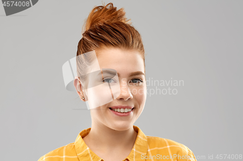 Image of portrait of smiling red haired teenage girl