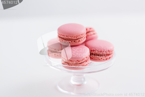 Image of pink macarons on glass confectionery stand