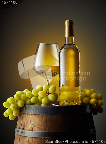 Image of glass and bottle of white wine