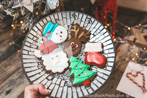 Image of A plate of festive shaped gingerbread at Christmas time