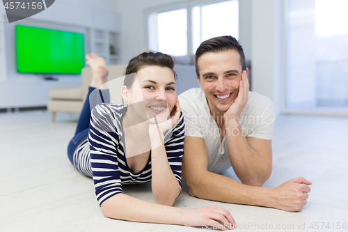 Image of couple lying on the floor at home