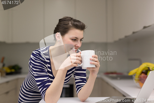 Image of woman drinking coffee enjoying relaxing lifestyle