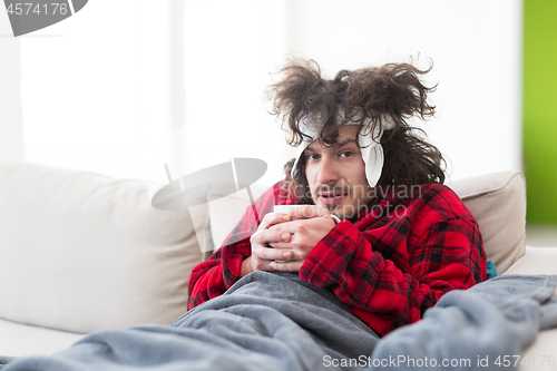 Image of young Man with flu and fever