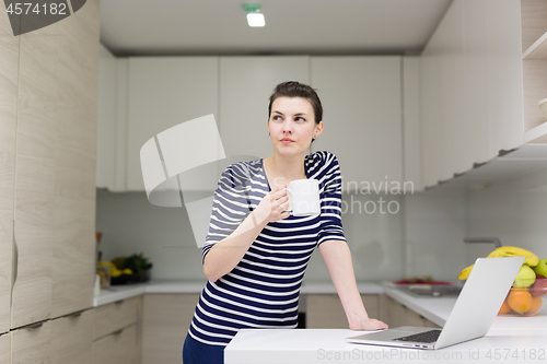 Image of woman drinking coffee enjoying relaxing lifestyle