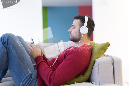 Image of man enjoying music through headphones