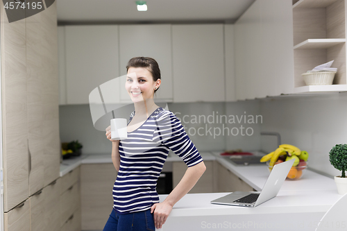 Image of woman drinking coffee enjoying relaxing lifestyle