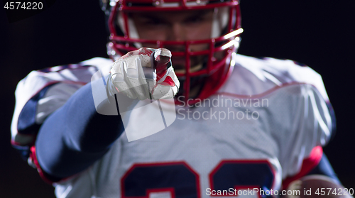 Image of portrait of confident American football player