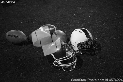 Image of american football and helmets