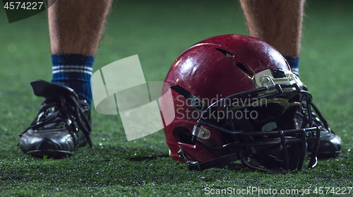 Image of closeup of american football player and helmet