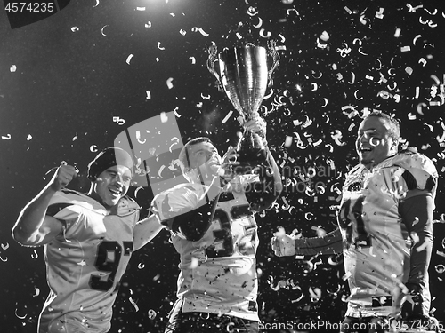 Image of american football team celebrating victory