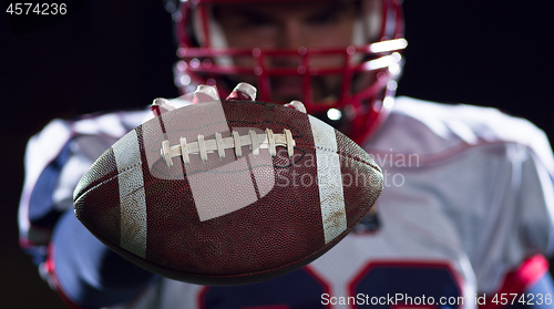 Image of portrait of confident American football player