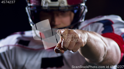 Image of portrait of confident American football player