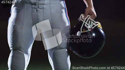 Image of portrait of young confident American football player