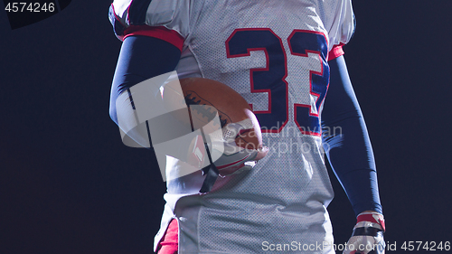 Image of portrait of confident American football players