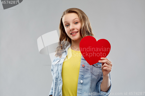 Image of smiling teenage girl with red heart