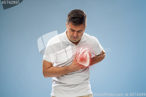 Image of unhappy man having heart attack or heartache