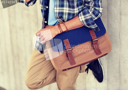 Image of close up of hipster man with stylish shoulder bag