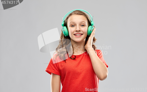 Image of happy teenage girl with headphones