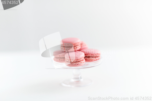 Image of pink macarons on glass confectionery stand