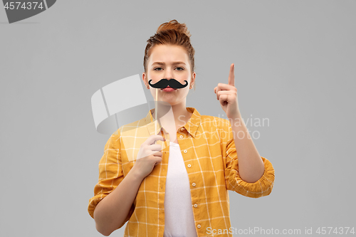 Image of teenage girl with moustaches pointing finger up