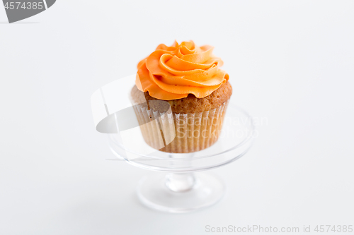 Image of cupcake with frosting on confectionery stand