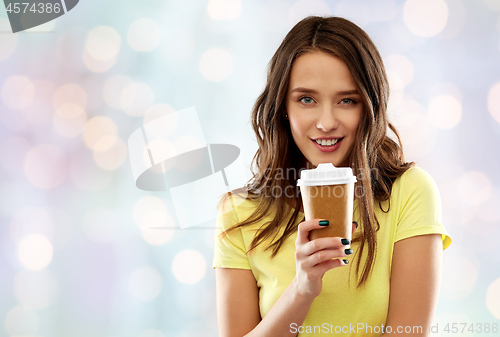 Image of young woman or teenage girl drinking coffee