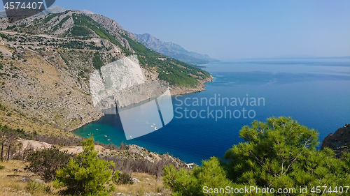 Image of Rocky beach, bue transparent sea