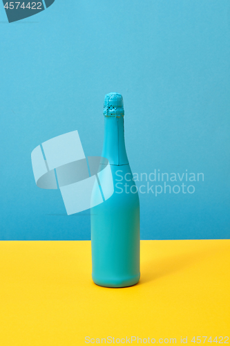 Image of Blue painted holiday mockup bottle on a duotone background.