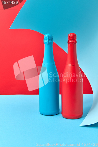 Image of Decorative composition of two painted wine mock up bottles.