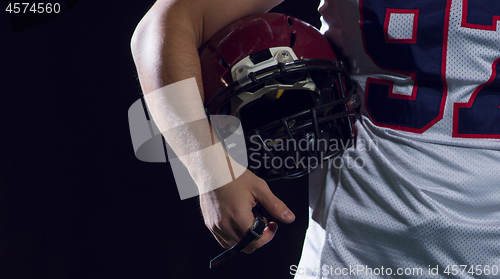 Image of portrait of young confident American football player