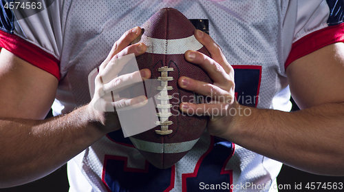 Image of portrait of confident American football player