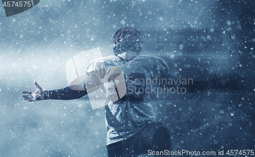 Image of american football player celebrating after scoring a touchdown