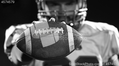Image of portrait of confident American football player