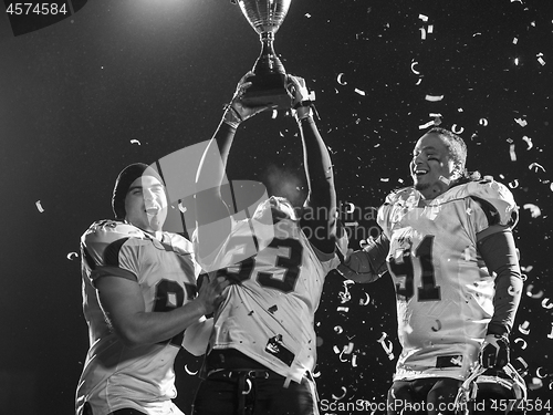 Image of american football team celebrating victory