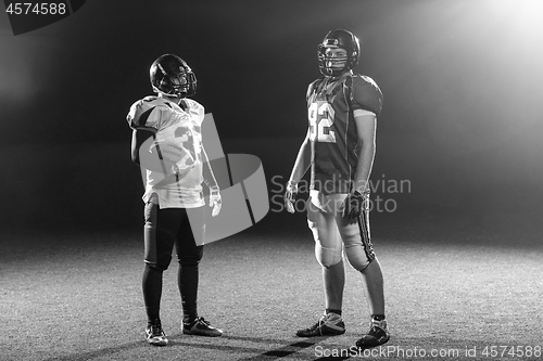 Image of portrait of confident American football players