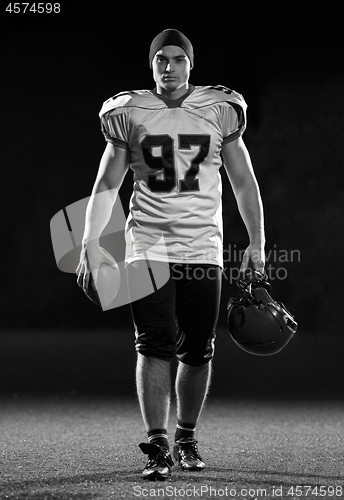 Image of portrait of young confident American football player