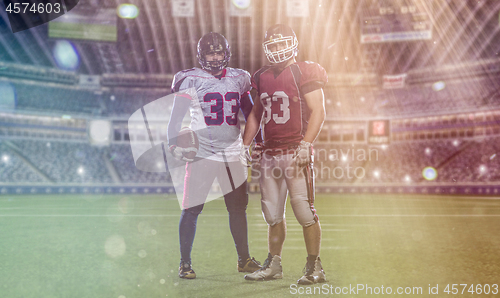 Image of Two American football players standing  on the field