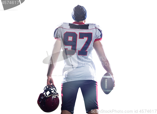 Image of rear view of young confident American football player